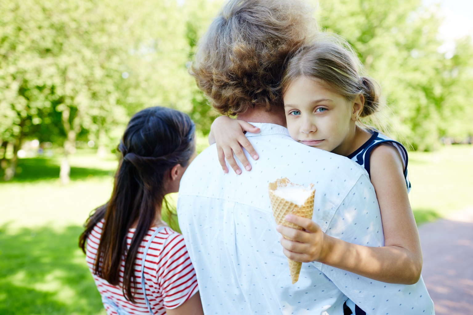 A family enjoying frozen treats together outdoors